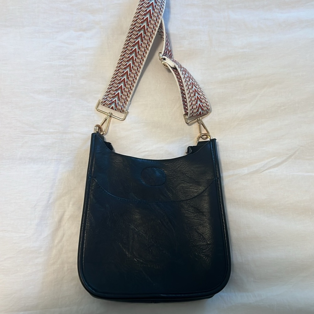 Black leather bag with adjustable shoulder strap
